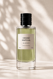 Perfume bottle labeled 'Cedar Matcha' by Alamara on a neutral background