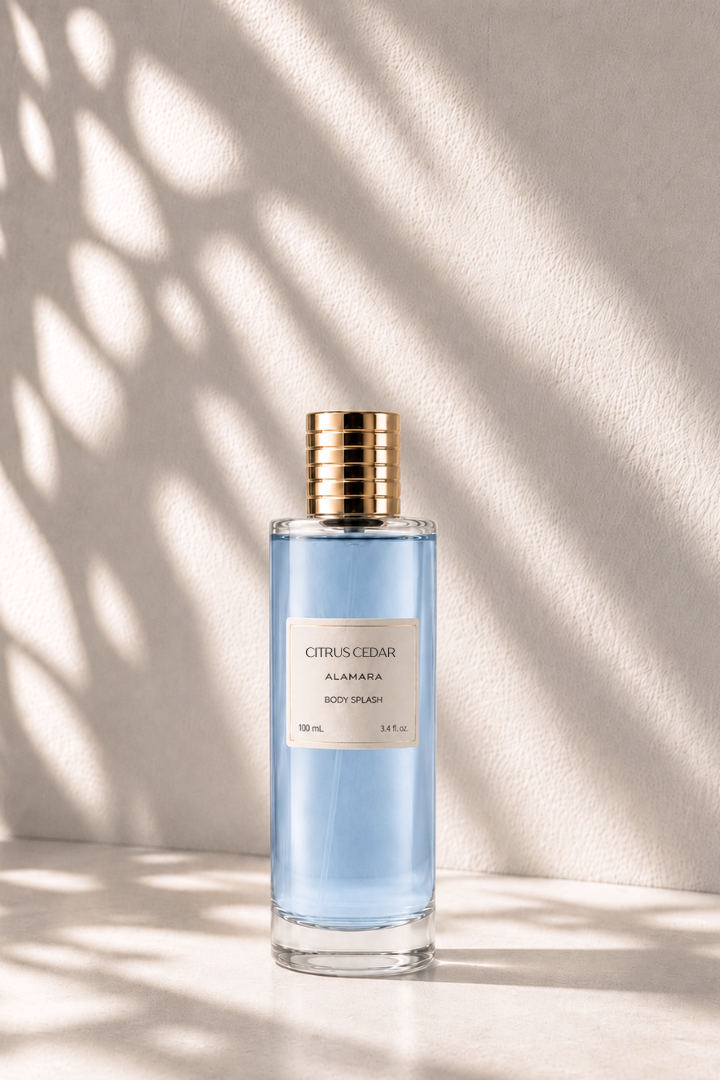 Bottle of Citrus Cedar body splash on a light background with shadows