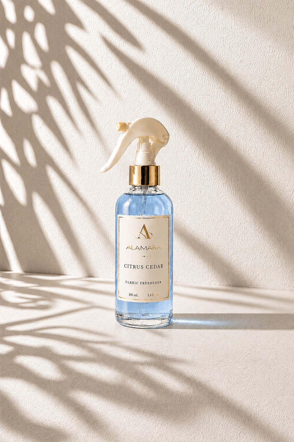 Spray bottle on a beige background with leaf shadows