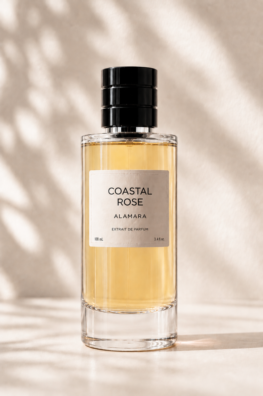 Perfume bottle labeled 'Coastal Rose' by Alamara on a neutral background