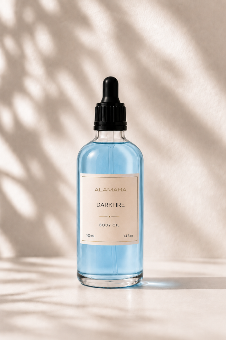 Bottle of Darkfire body oil on a neutral background