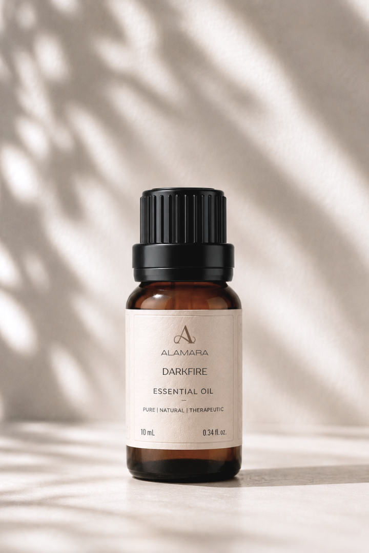 Alamara essential oil bottle on a neutral background with leaf shadows