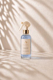 Spray bottle labeled 'Darkfire' on a beige background with shadow patterns