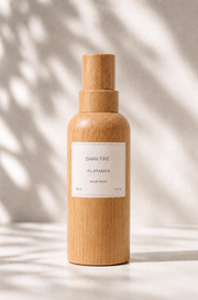 Wooden bottle with a label on a neutral background