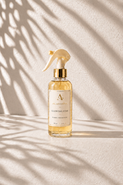 Bottle of Glowing Star on a textured beige background with shadow patterns.