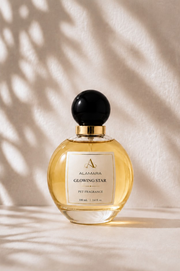 Perfume bottle labeled 'Saffron Nights' by Alamara on a beige background with shadow patterns.