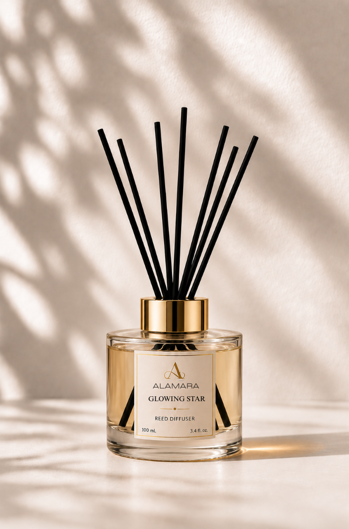 Reed diffuser with black sticks on a beige background