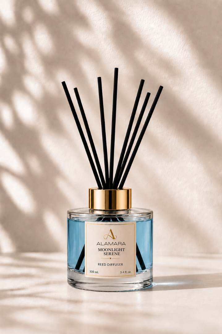 Reed diffuser with black sticks on a beige background
