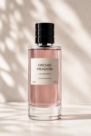 Perfume bottle labeled 'Orchid Meadow' by Alamara on a neutral background
