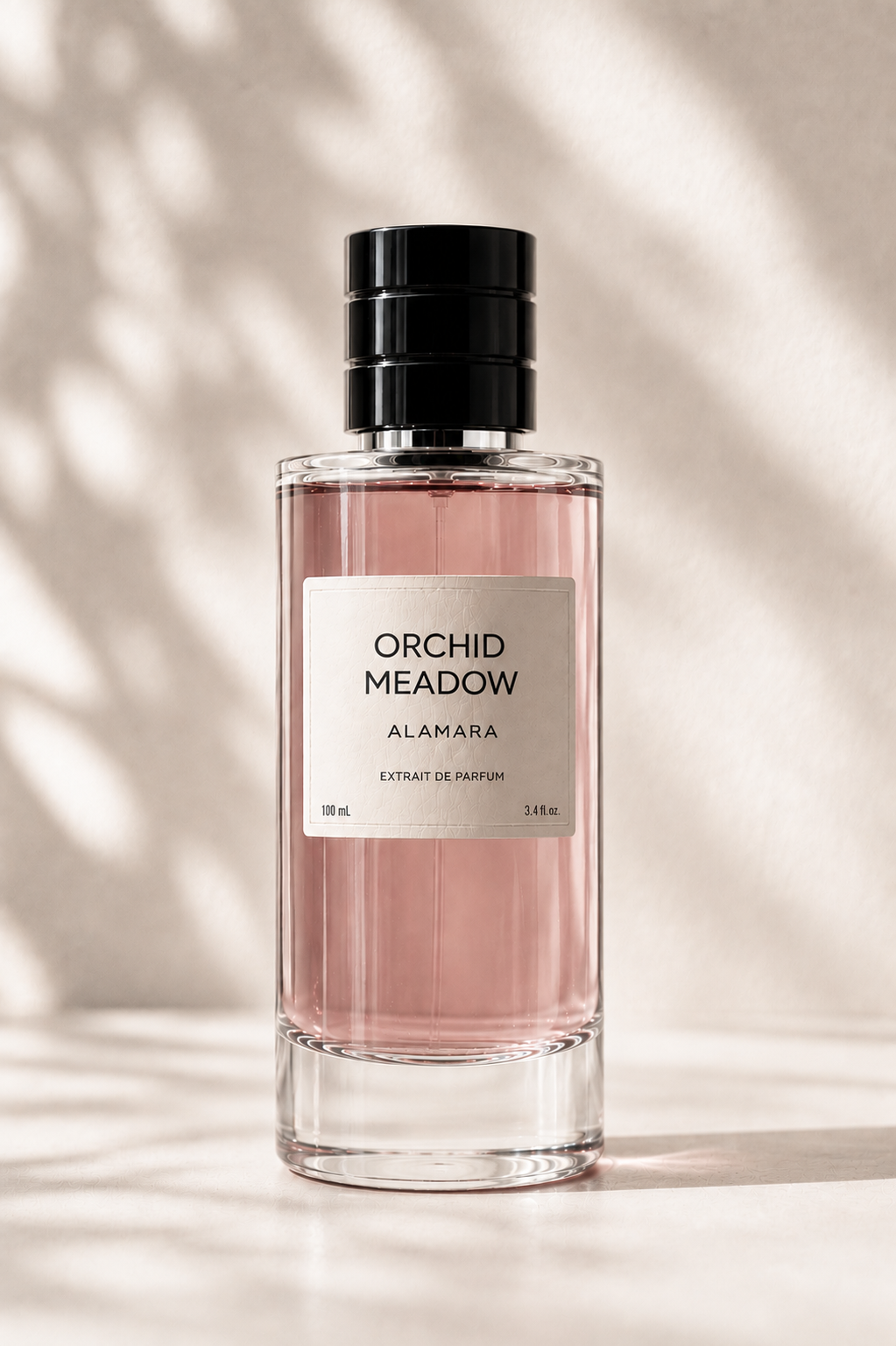 Perfume bottle labeled 'Orchid Meadow' by Alamara on a neutral background